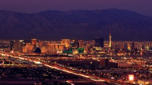 An image of the Las Vegas strip with mountains in the background.