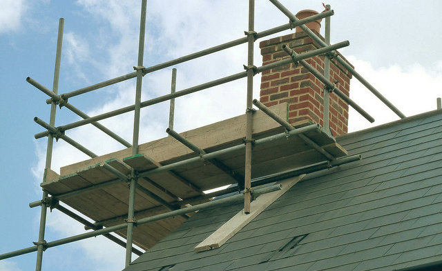 An image of scaffolding being placed on a property renovation